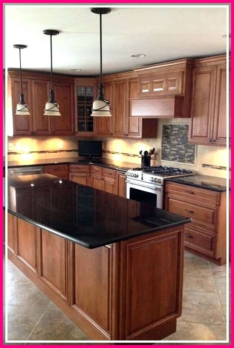 dark brown granite with oak cabinets and stainless steel appliances|granite countertops with oak cabinet.